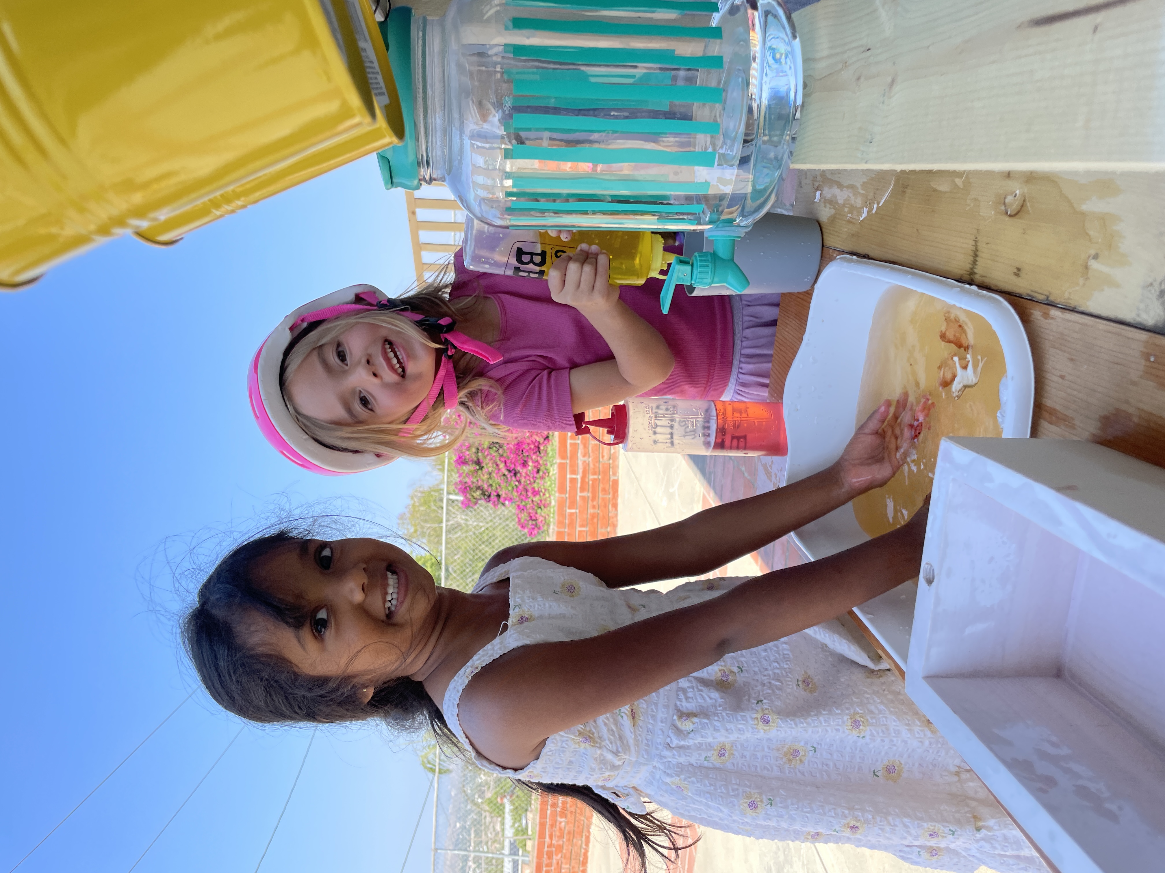 Girls enjoying water play outdoors